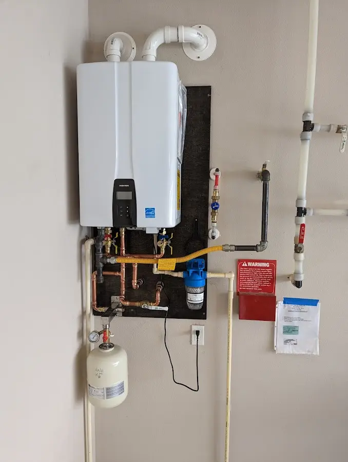 Professional plumber installing copper piping in a Rockledge home